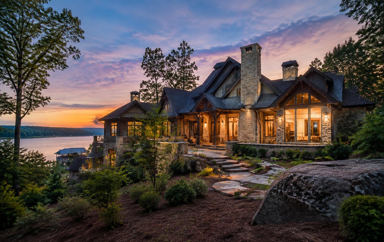 Completed custom lakefront estate at twilight in Mooresville