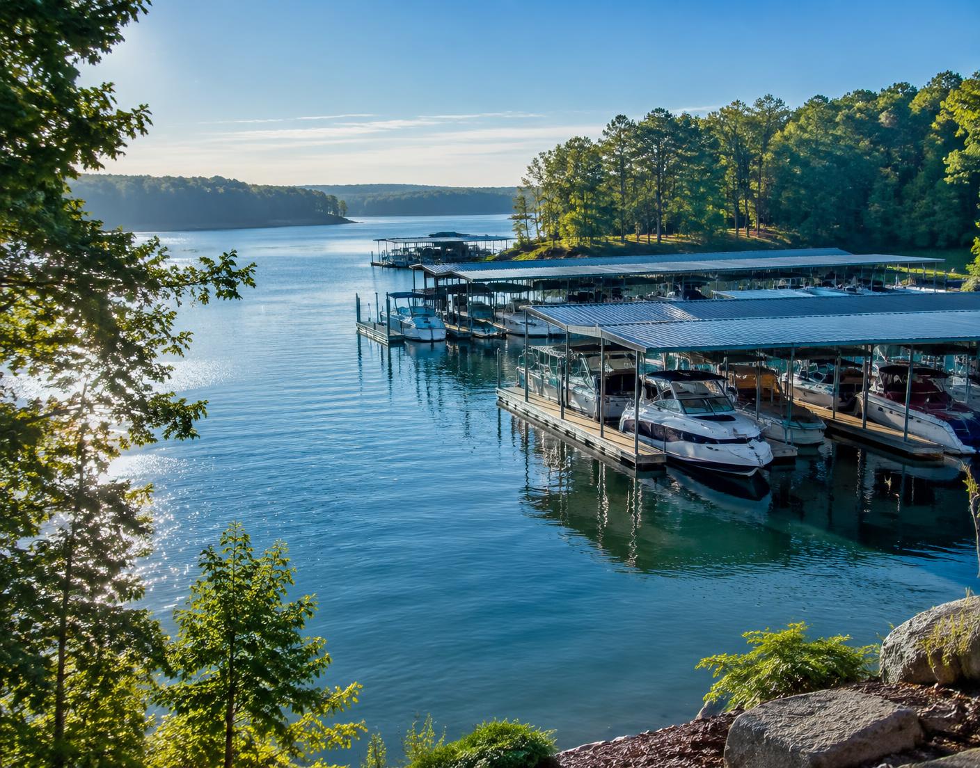 Boat cruising past waterfront homes on Lake Norman near Mooresville