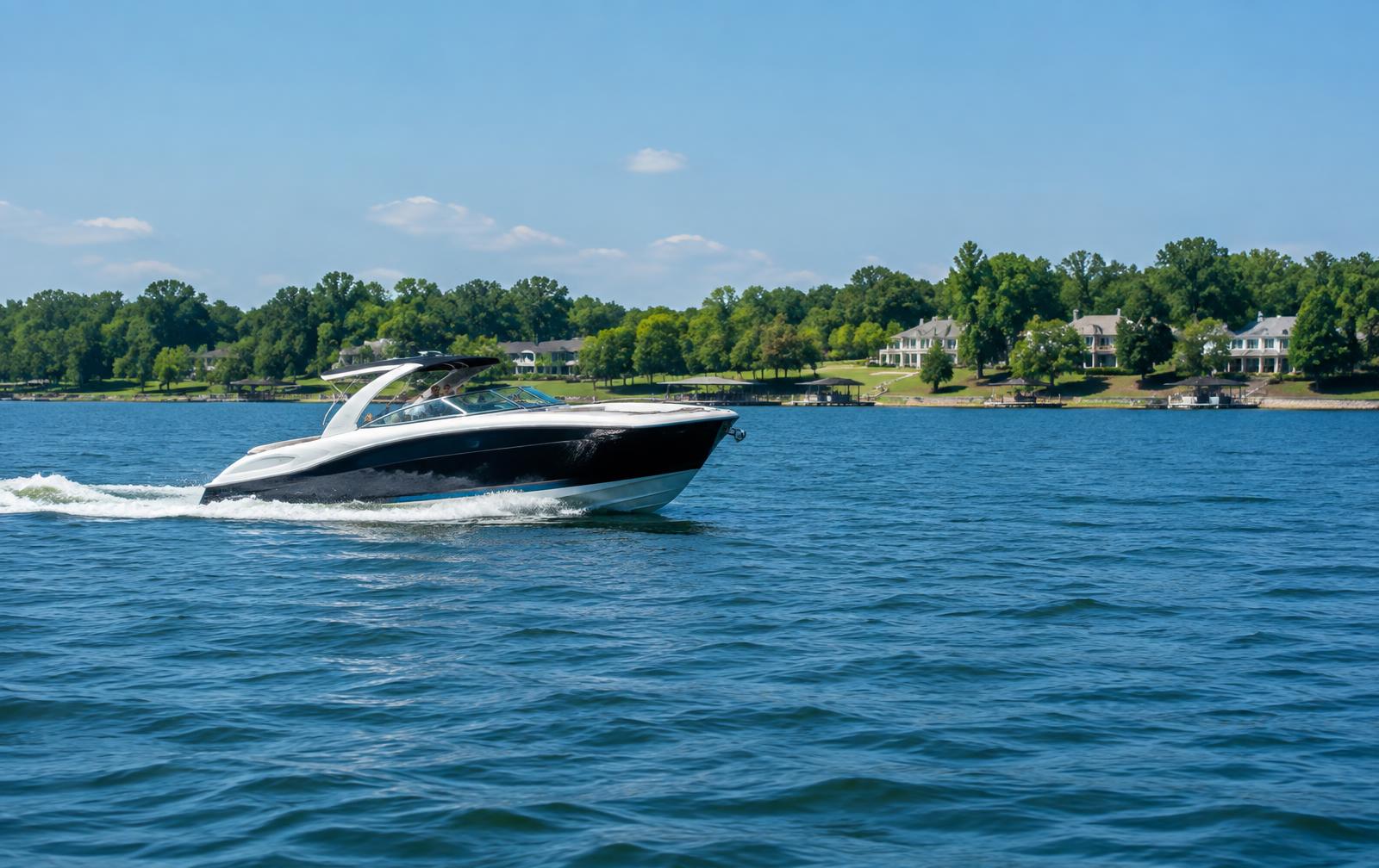 Motorboat cruising on Lake Norman near the Mooresville shoreline